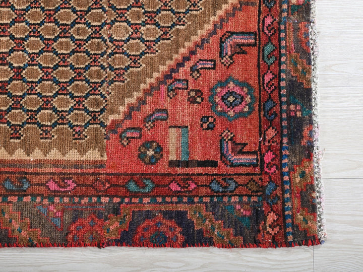 a rug with a design on it on a wooden floor