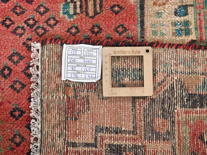 a piece of wood sitting on top of a rug