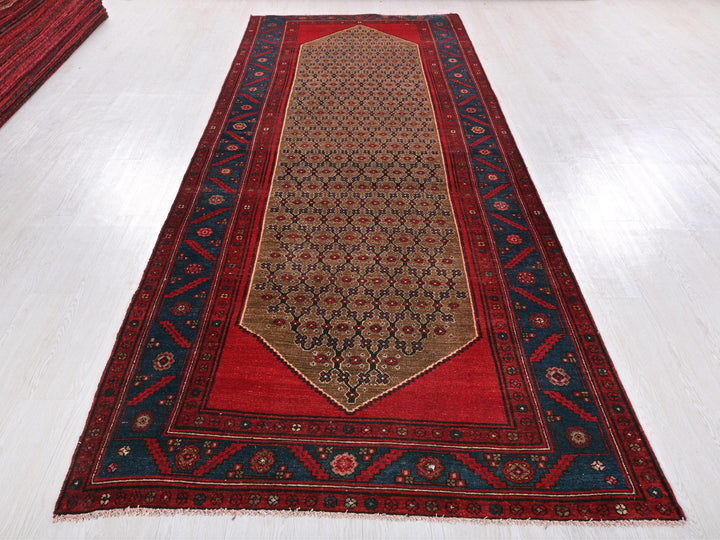 a red and blue rug on a white floor