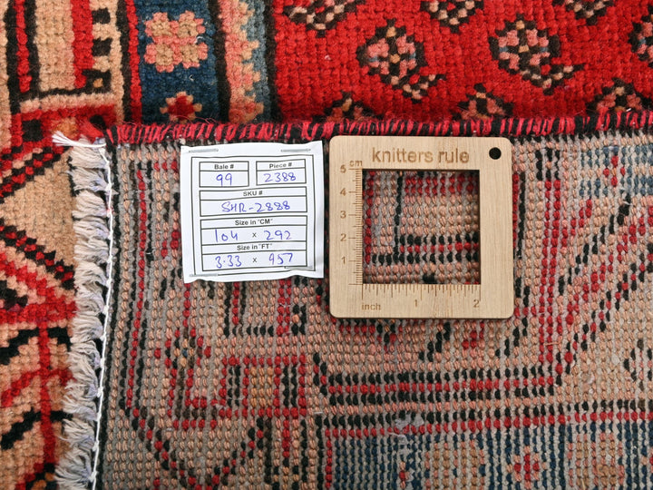 a ruler is on top of a pile of rugs