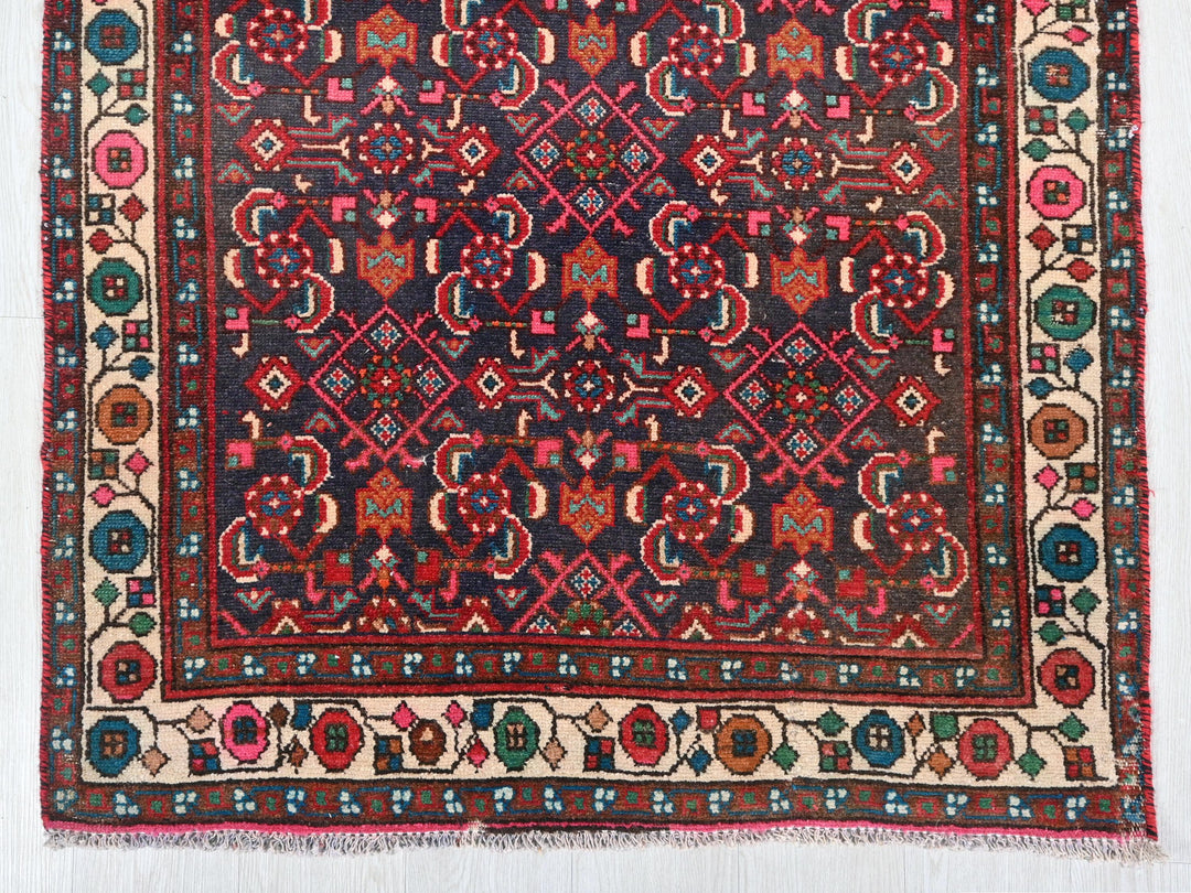 a rug with a red and blue design on it