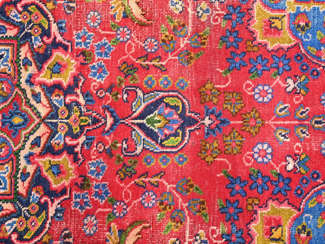 a close up of an oriental rug with many colors
