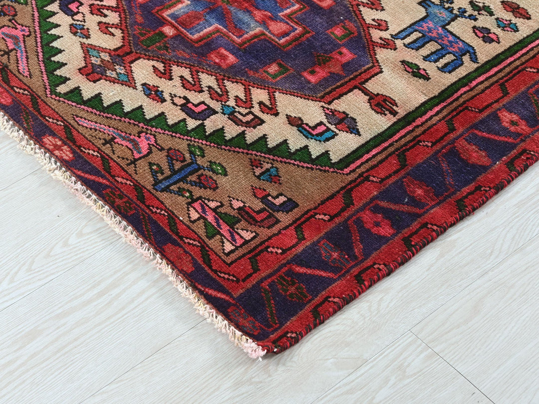 a colorful oriental rug on a white wooden floor