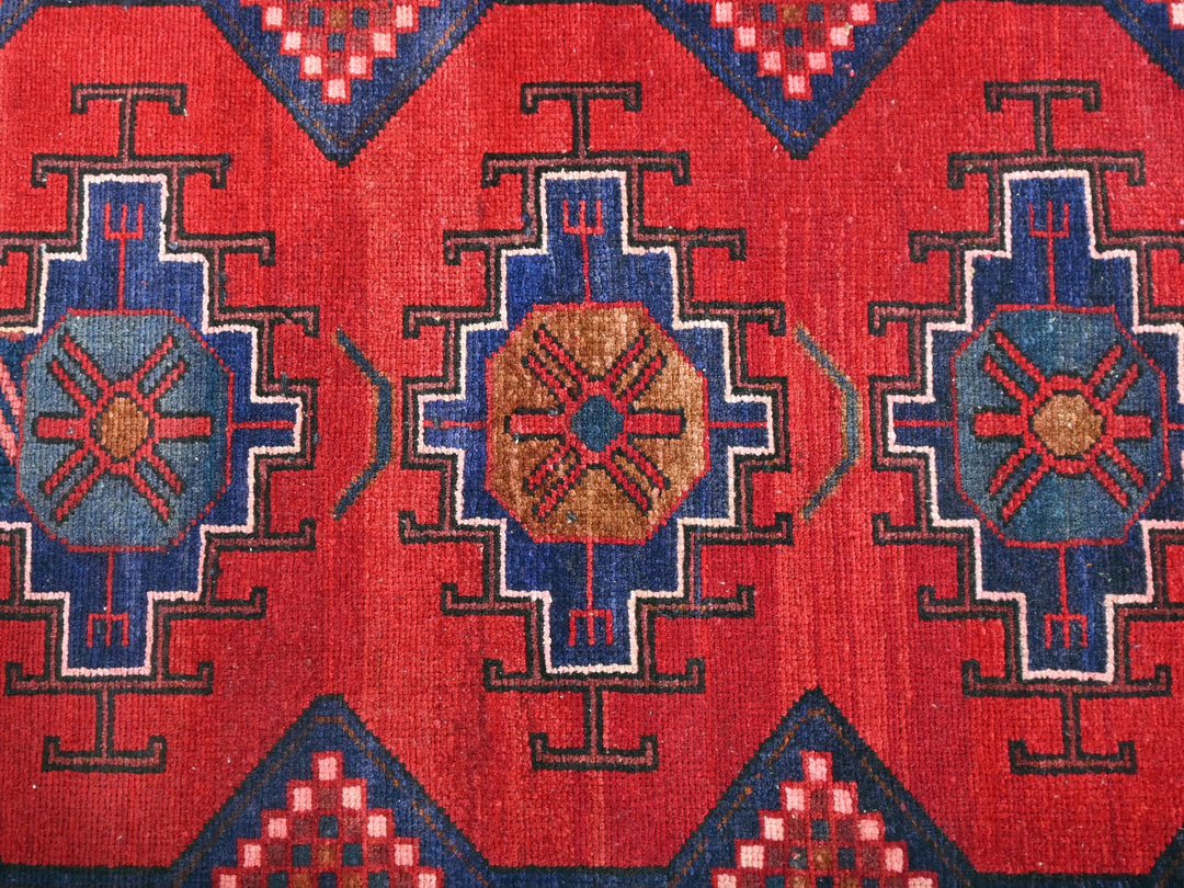 a close up of a red and blue rug