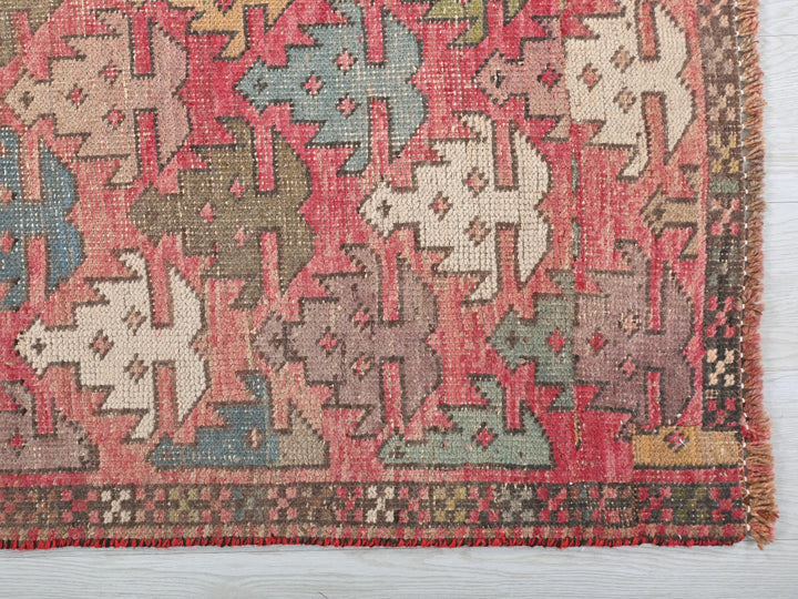 an old rug with a lot of animals on it