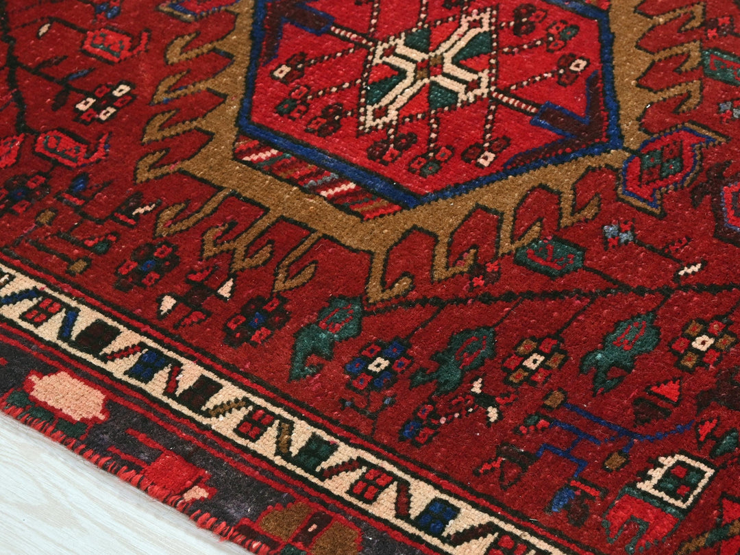 a close up of a red oriental rug
