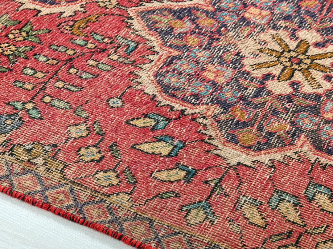 a close up of a rug on a wooden floor