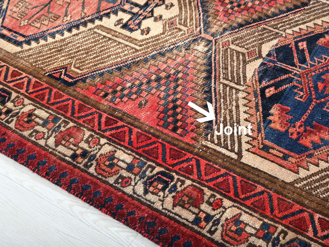 a close up of a rug with a white arrow pointing to it