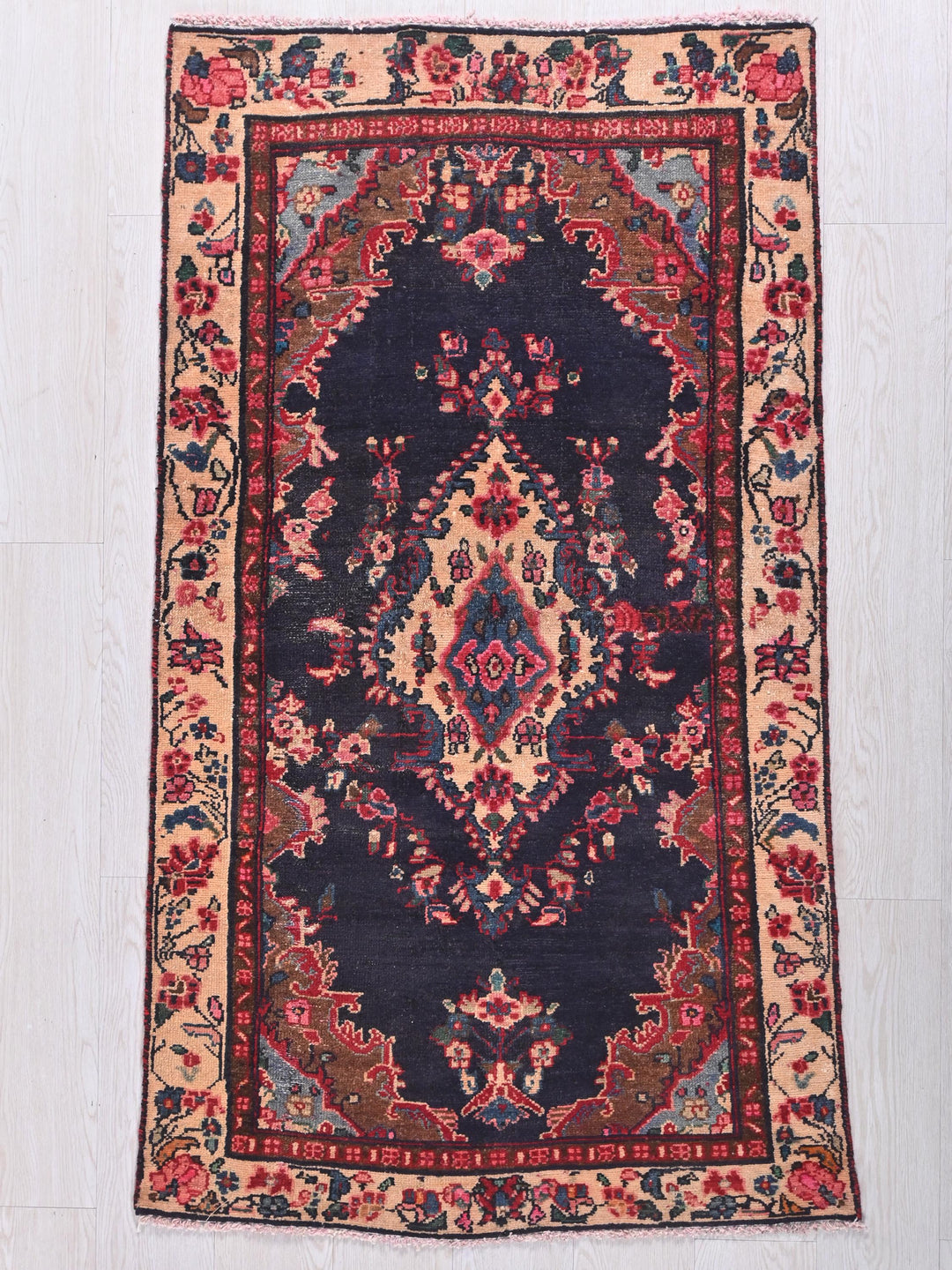 a blue rug with a red and blue design