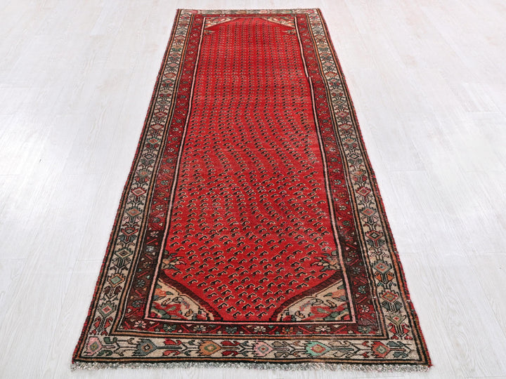 a red rug on a white floor in a room