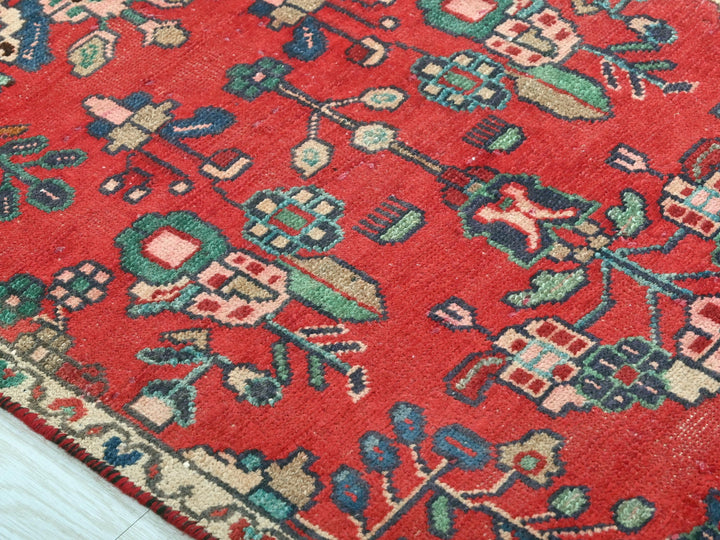 a close up of a rug on a wooden floor