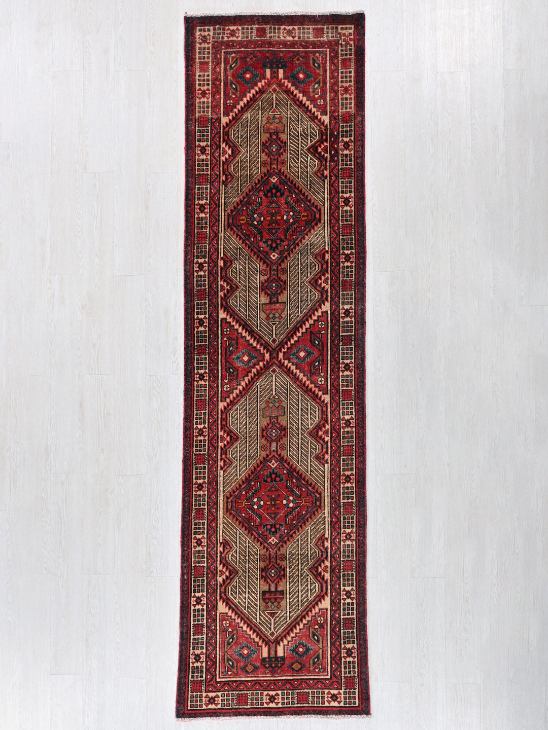 a rug hanging on a wall in a room
