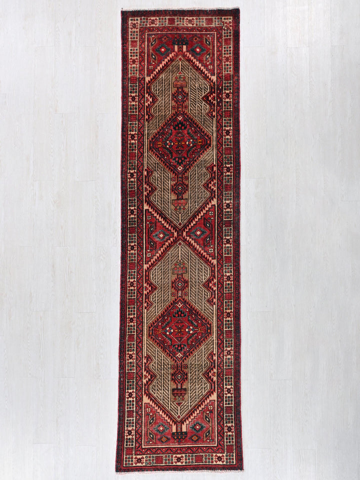 a rug hanging on a wall in a room