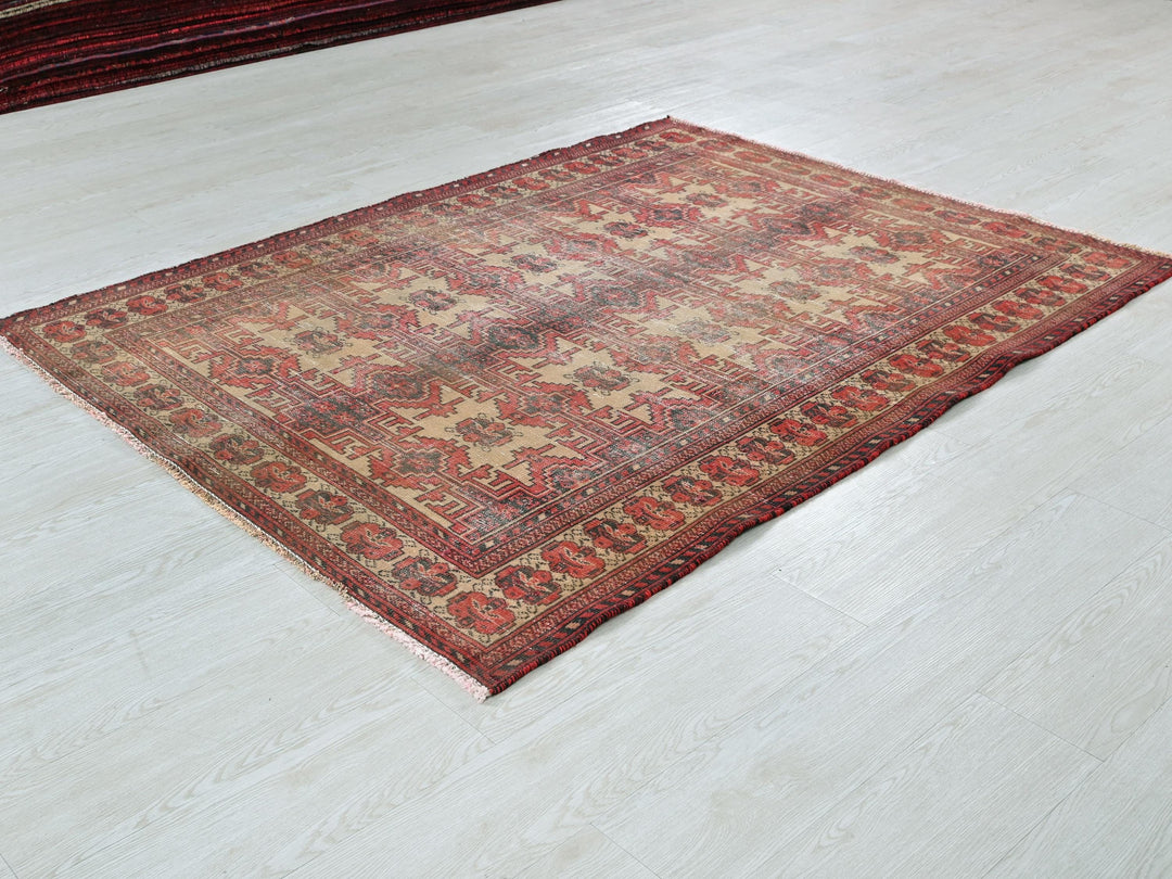 a red rug on a white floor in a room