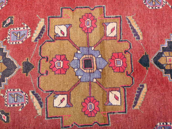 a close up of a rug with a red background