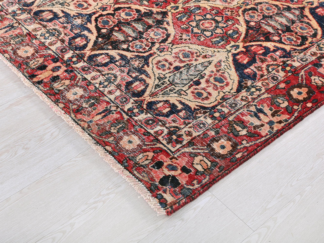 a red and blue rug on a white floor
