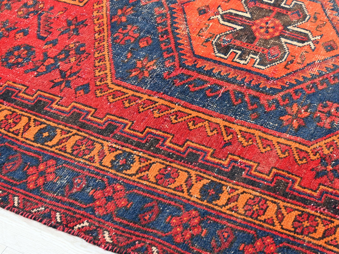 a red, blue, and orange oriental rug