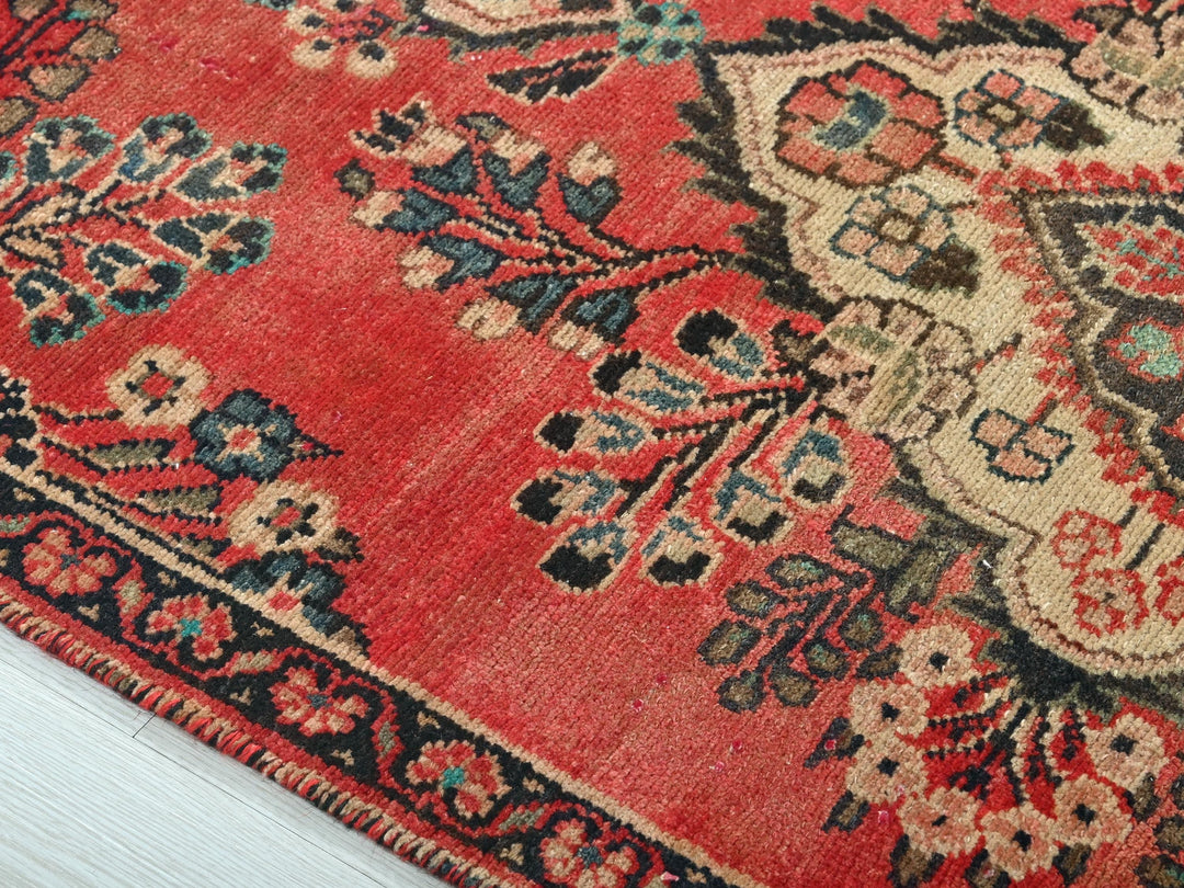 a close up of a rug on a wooden floor