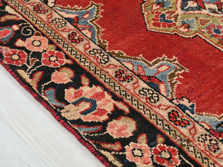 a close up of a rug on a wooden floor