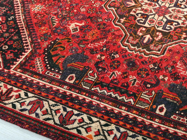 a close up of an oriental rug on the floor