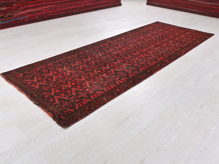 a red rug on the floor of a room