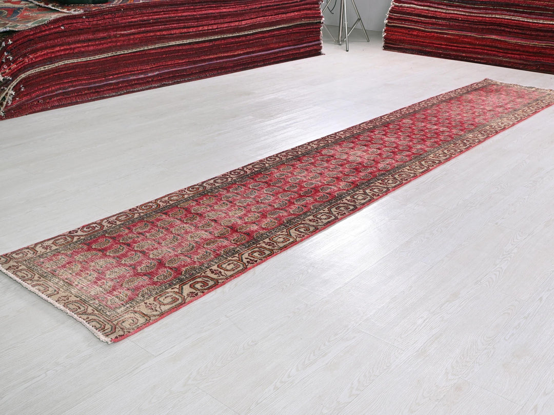 a white floor with a red rug on top of it