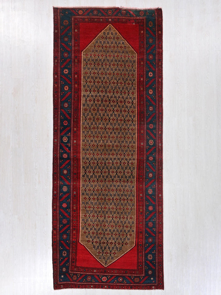 a red rug hanging on a wall