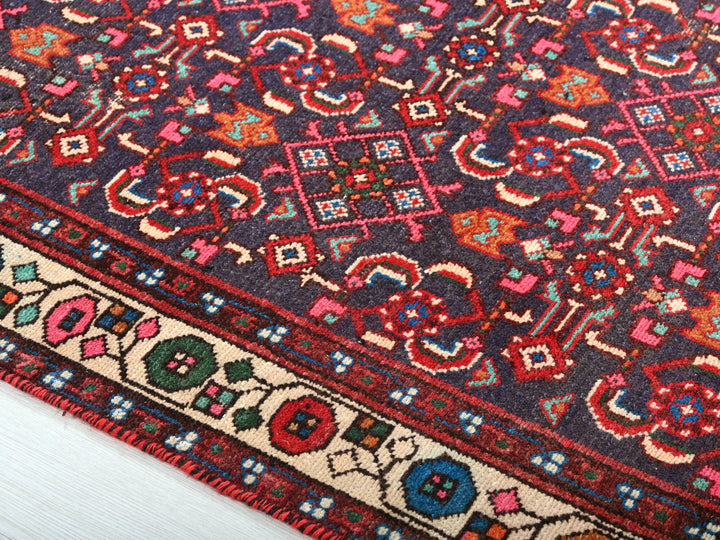 a close up of a rug on a wooden floor