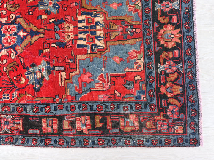a red and blue rug with a horse on it
