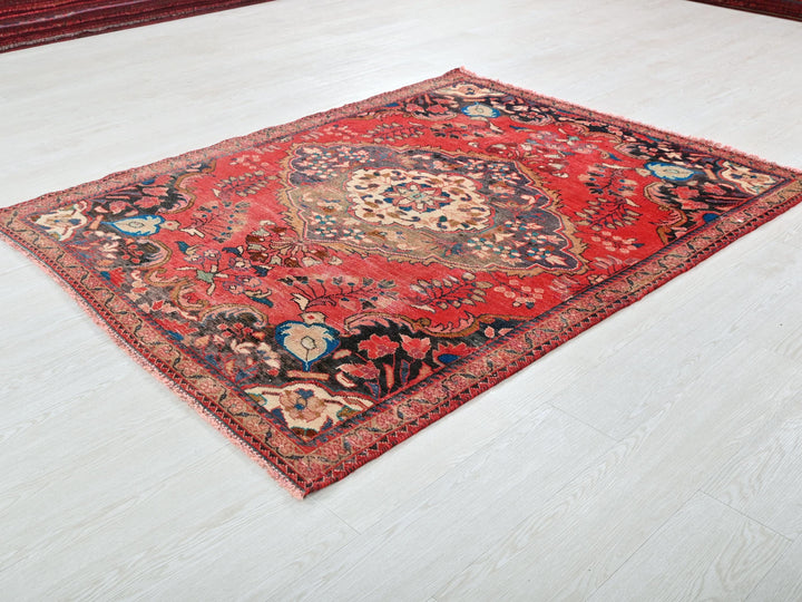 a red rug on the floor of a room