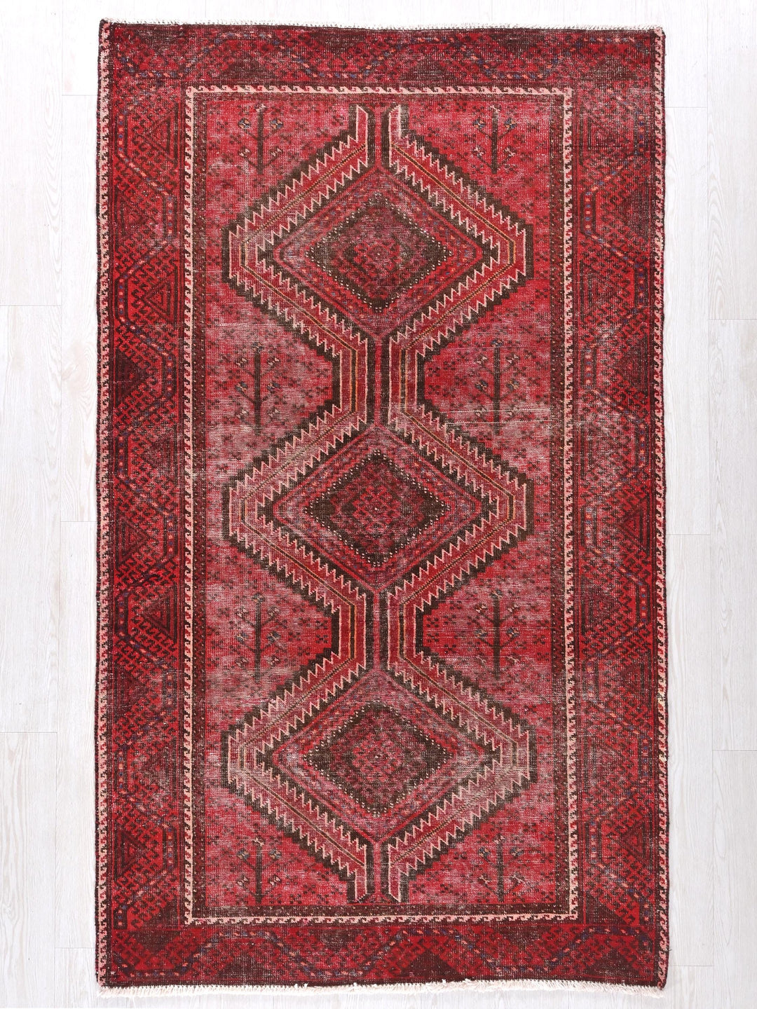 a red rug on a white floor