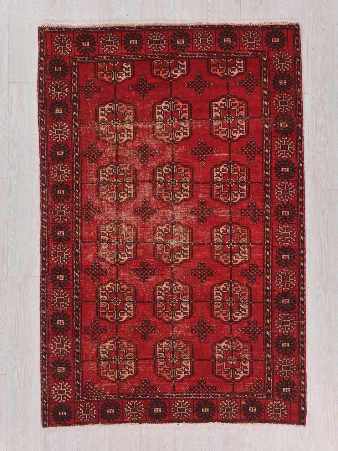 a red rug on a white floor