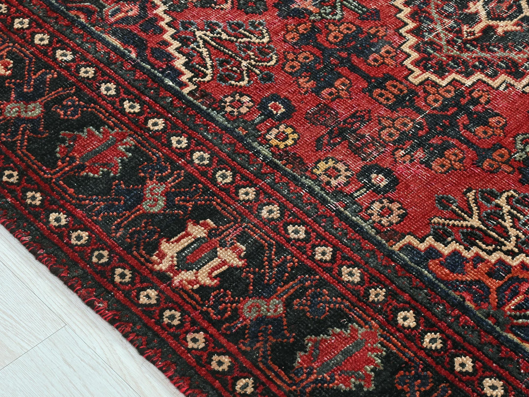 a close up of a rug on a wooden floor