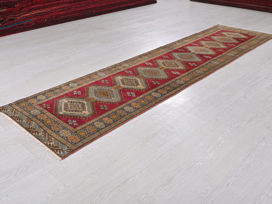 a red rug on the floor of a room