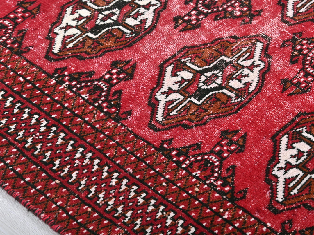 a close up of a red oriental rug