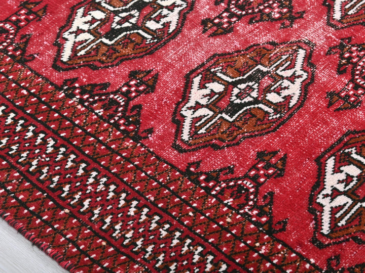 a close up of a red oriental rug