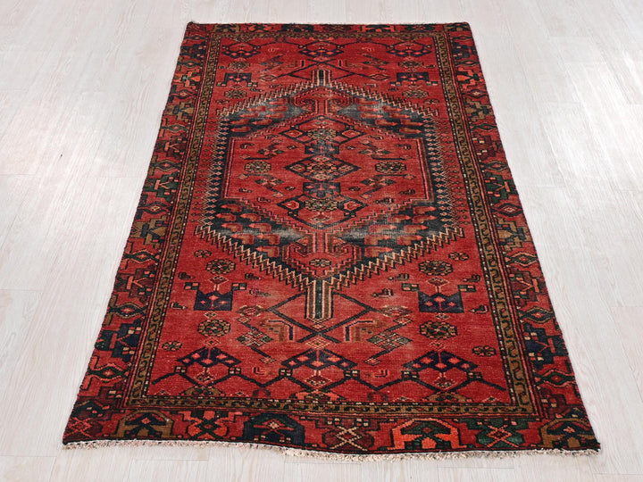 a red rug on a white floor in a room