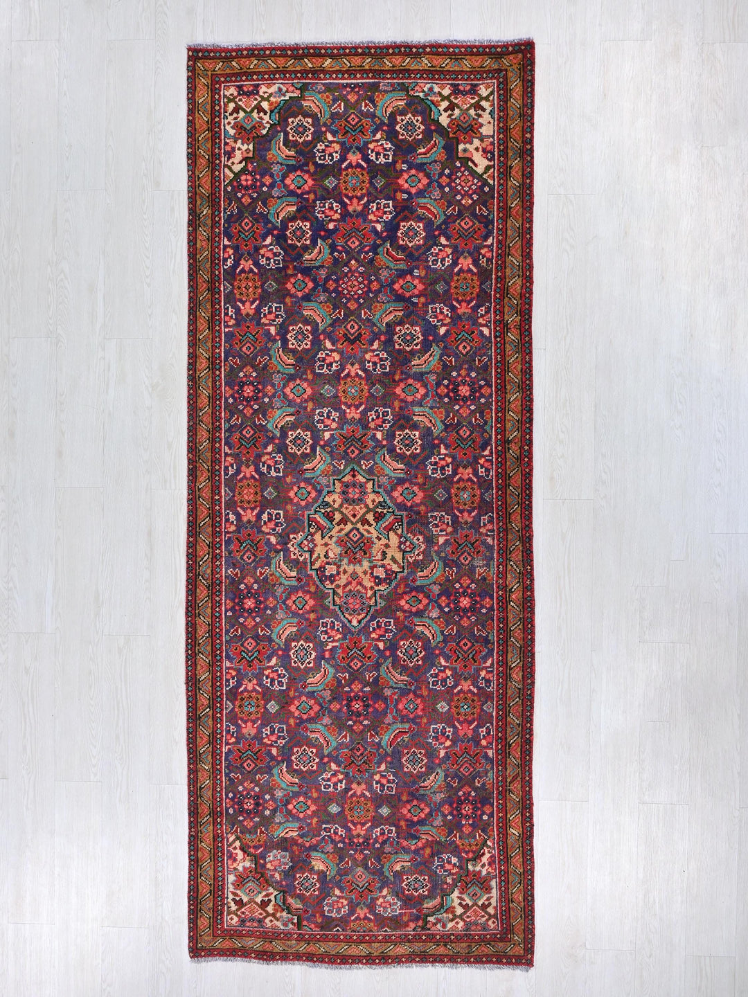 a rug hanging on a wall in a room