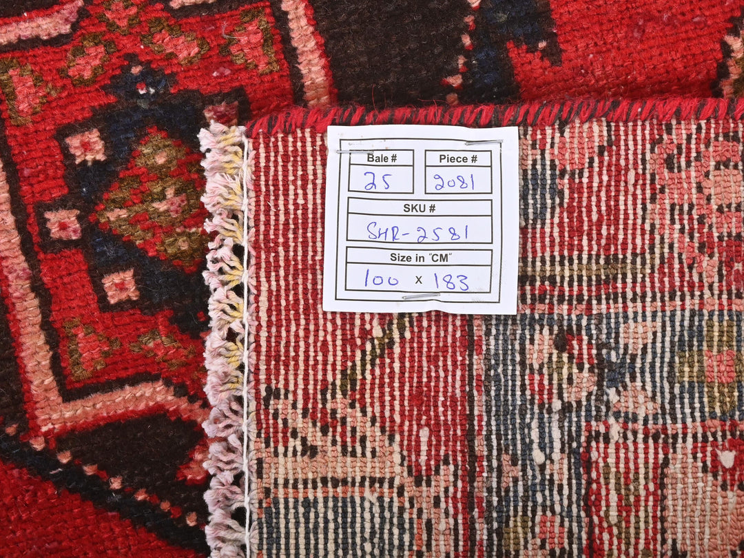 a pile of rugs with a price label on them
