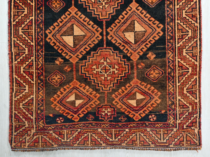 an old rug with a design on it