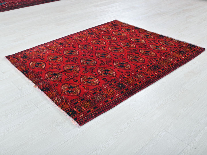 a red rug is laying on the floor