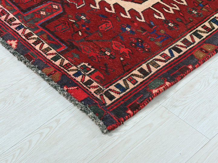 a red rug with a horse on it