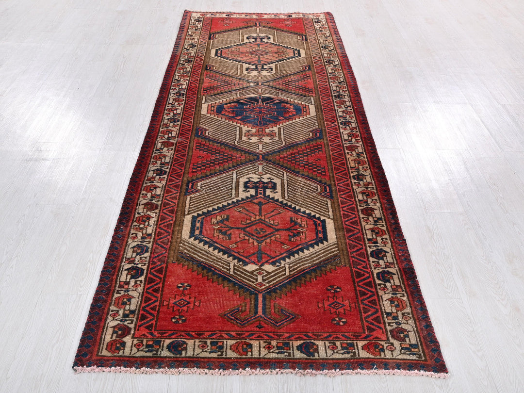 a red rug on a white floor in a room