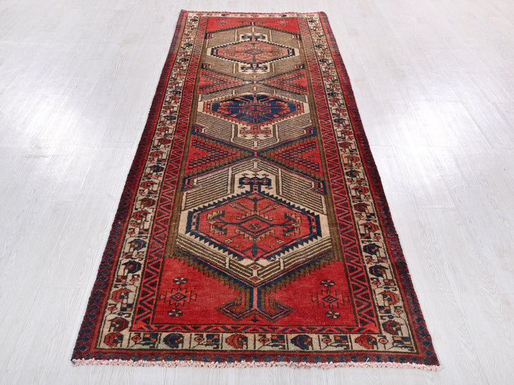 a red rug on a white floor in a room