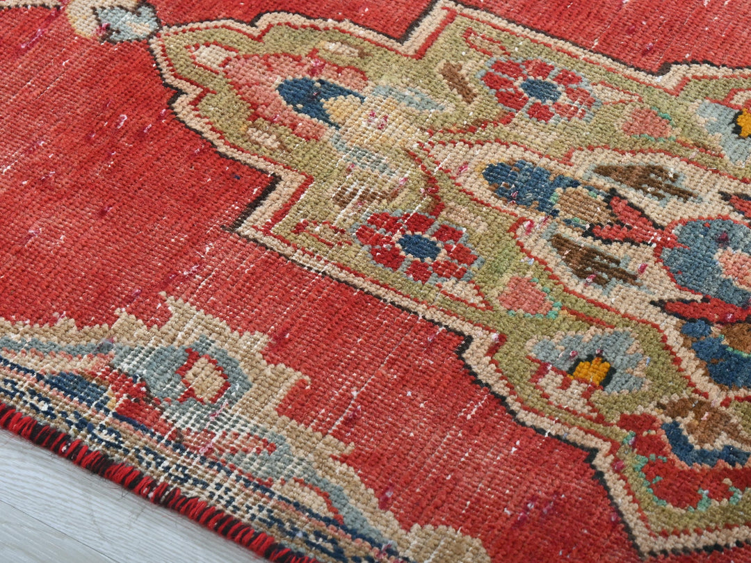 a close up of a rug on a wooden floor