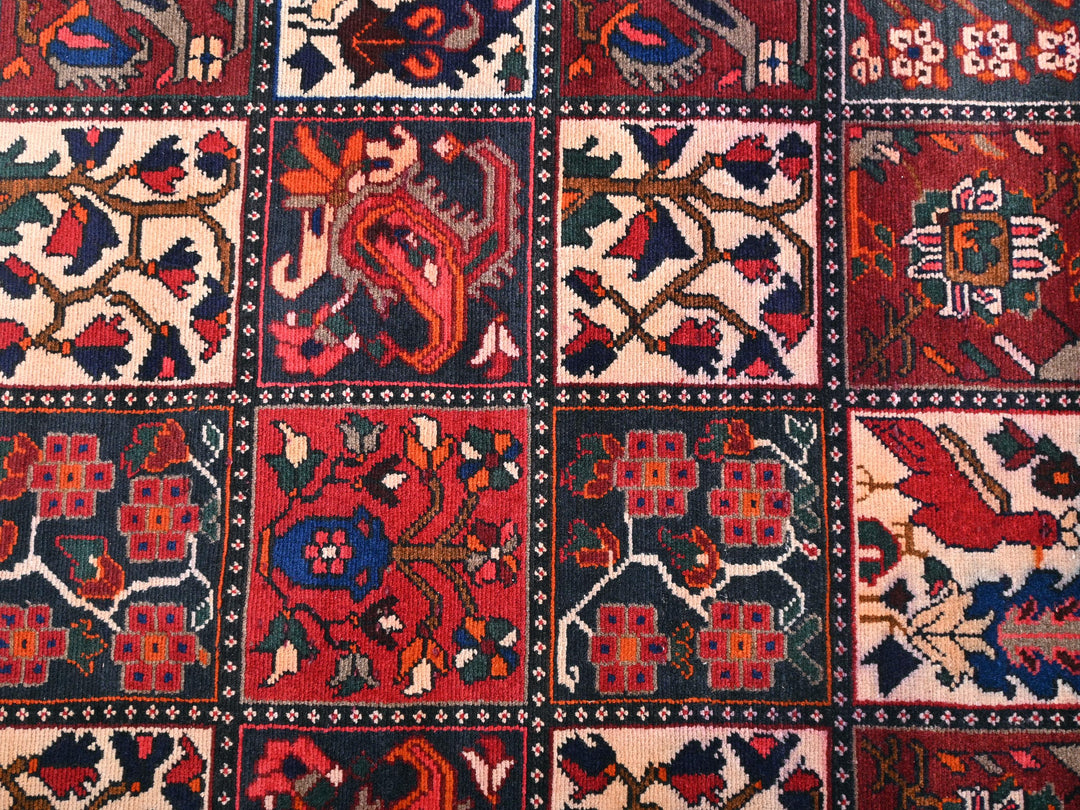 a red rug with many different designs on it