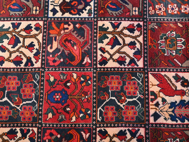 a red rug with many different designs on it