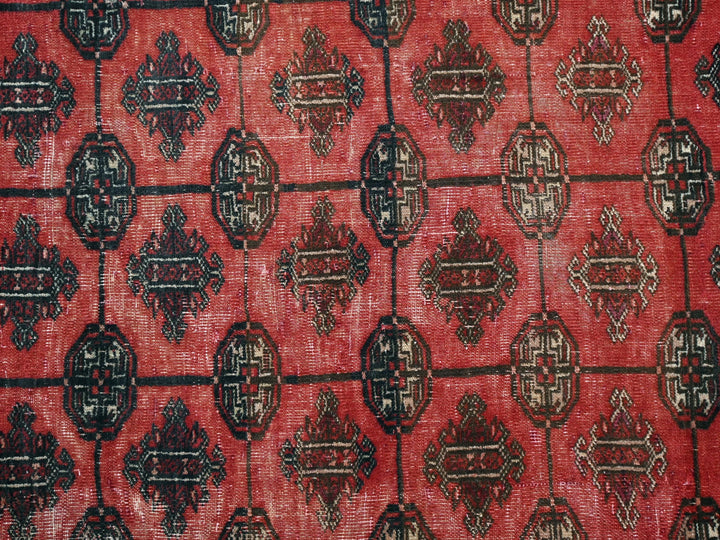 a close up of a red and black rug