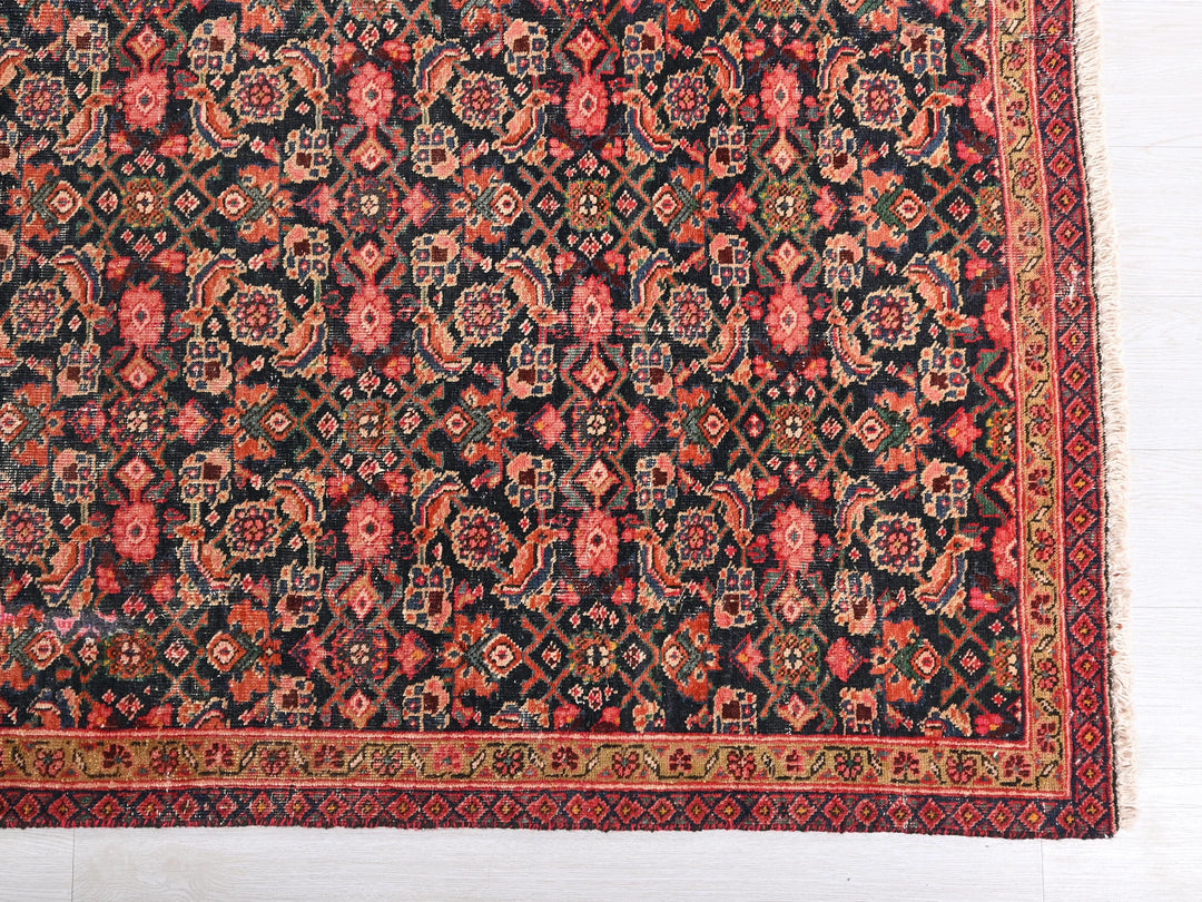 an antique persian rug on a white floor