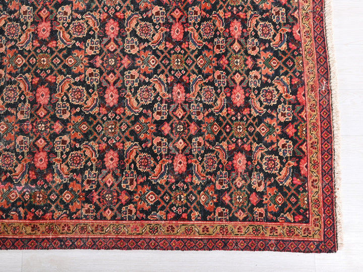 an antique persian rug on a white floor